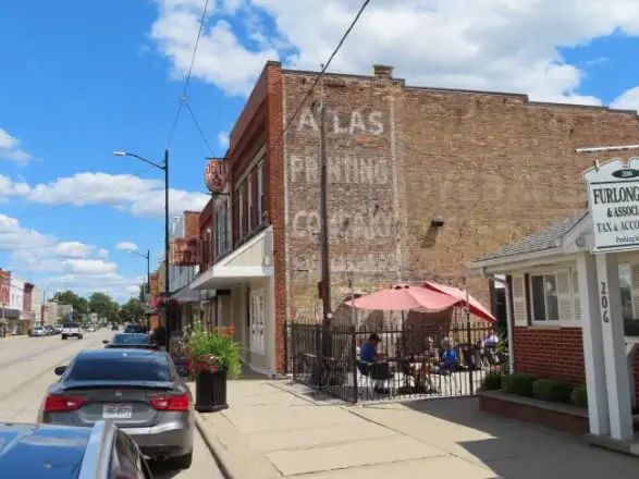 Side view of old brick building with 'Atlas Printing Company' painted on the side located in Delta, Ohio