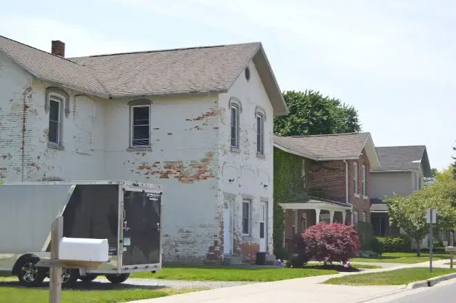 Old white brick home located in Holland, Ohio